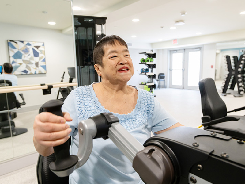 A women exercising at the community.