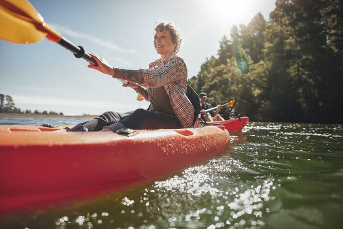 find purpose in retirement Senior woman canoeing
