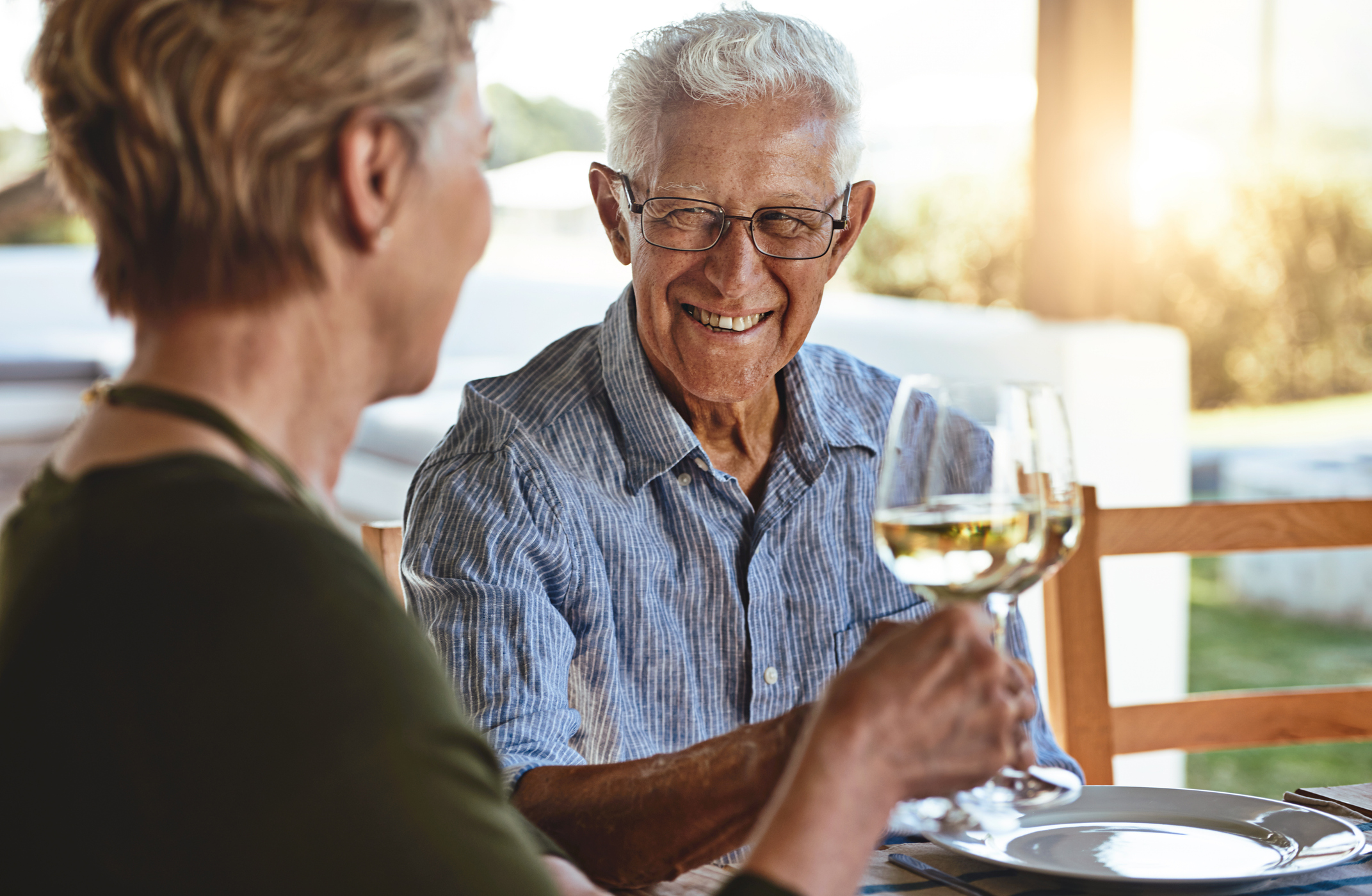 Shot of a happy mature couple enjoying lunch together outside