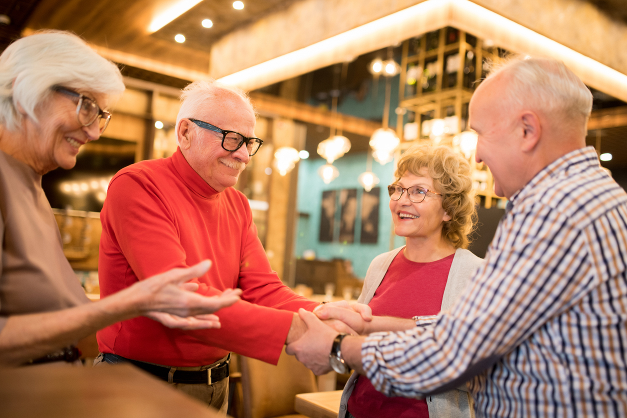 Ladies introducing their husbands to each other Fri-Yay! Live Music & Happy Hour